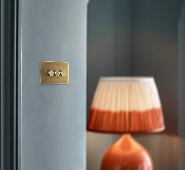 Lucian two gang dimmer switch in aged brass